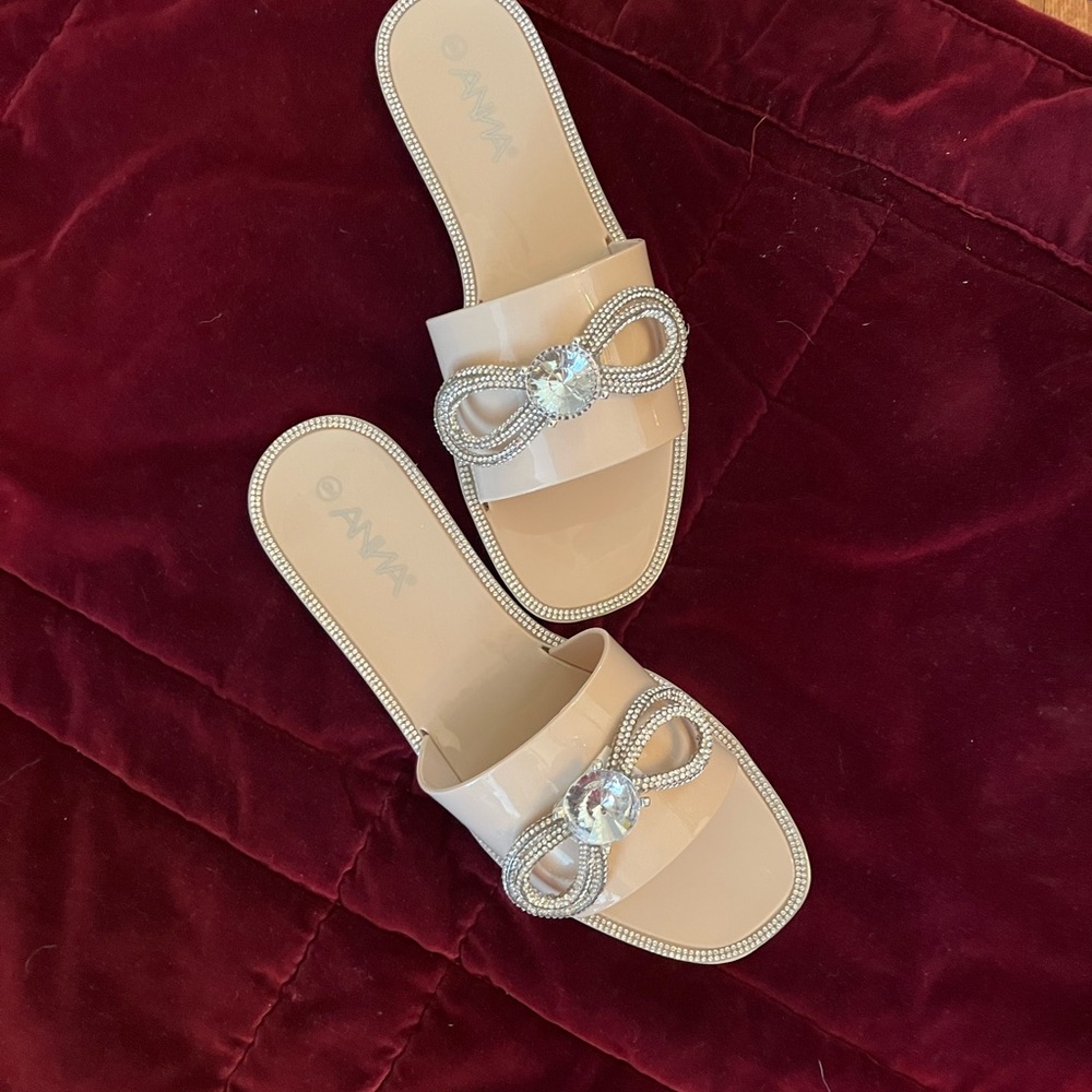 Anna Nude Patent Slide Sandals with Crystal Bow Accent